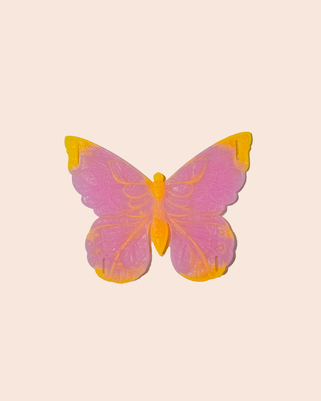 colorful butterfly-shaped intimate objects on a beige background with 'PAPYLLON' branding.